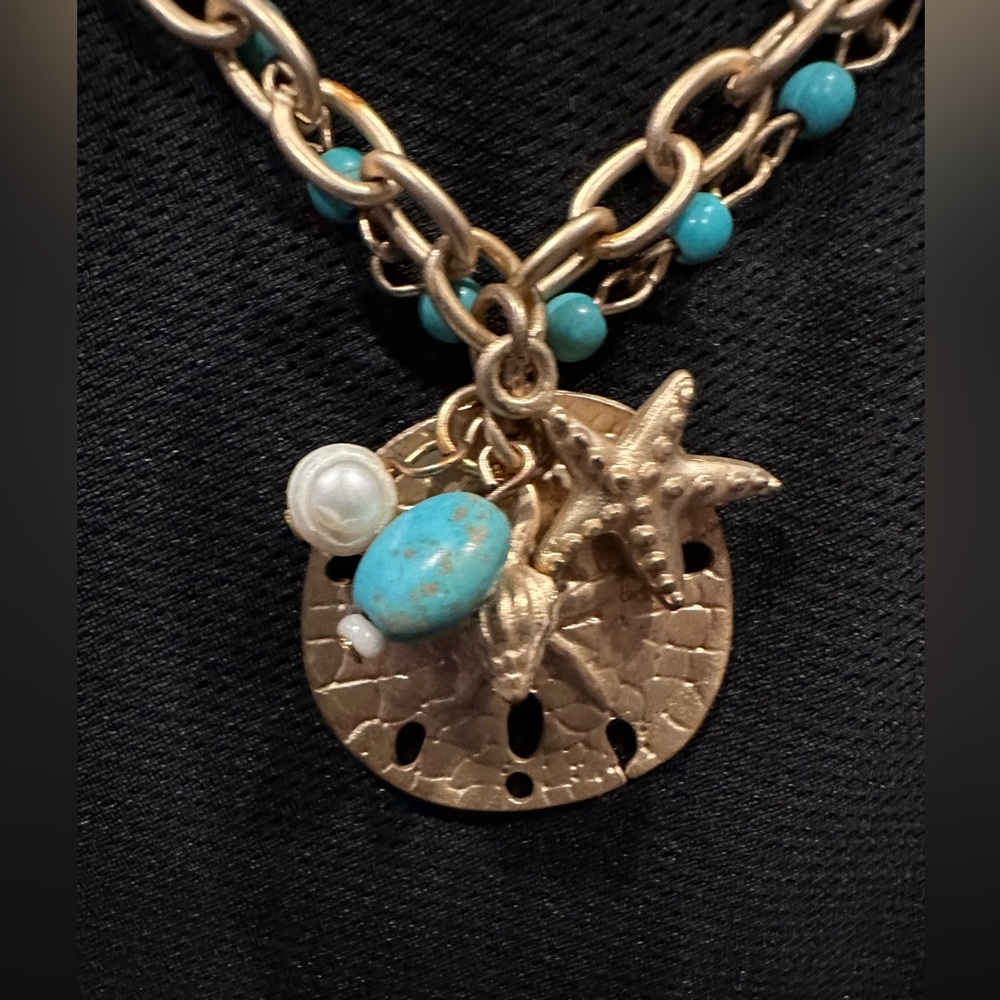Matte goldtone & turquoise blue seashell-themed necklace by Prodigal Daughter